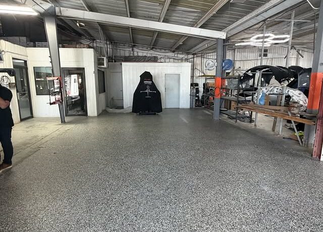Commercial warehouse flake epoxy floor by Epoxee