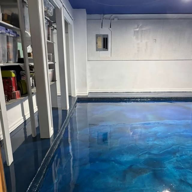 Blue metallic epoxy basement floor by Epoxee El Paso