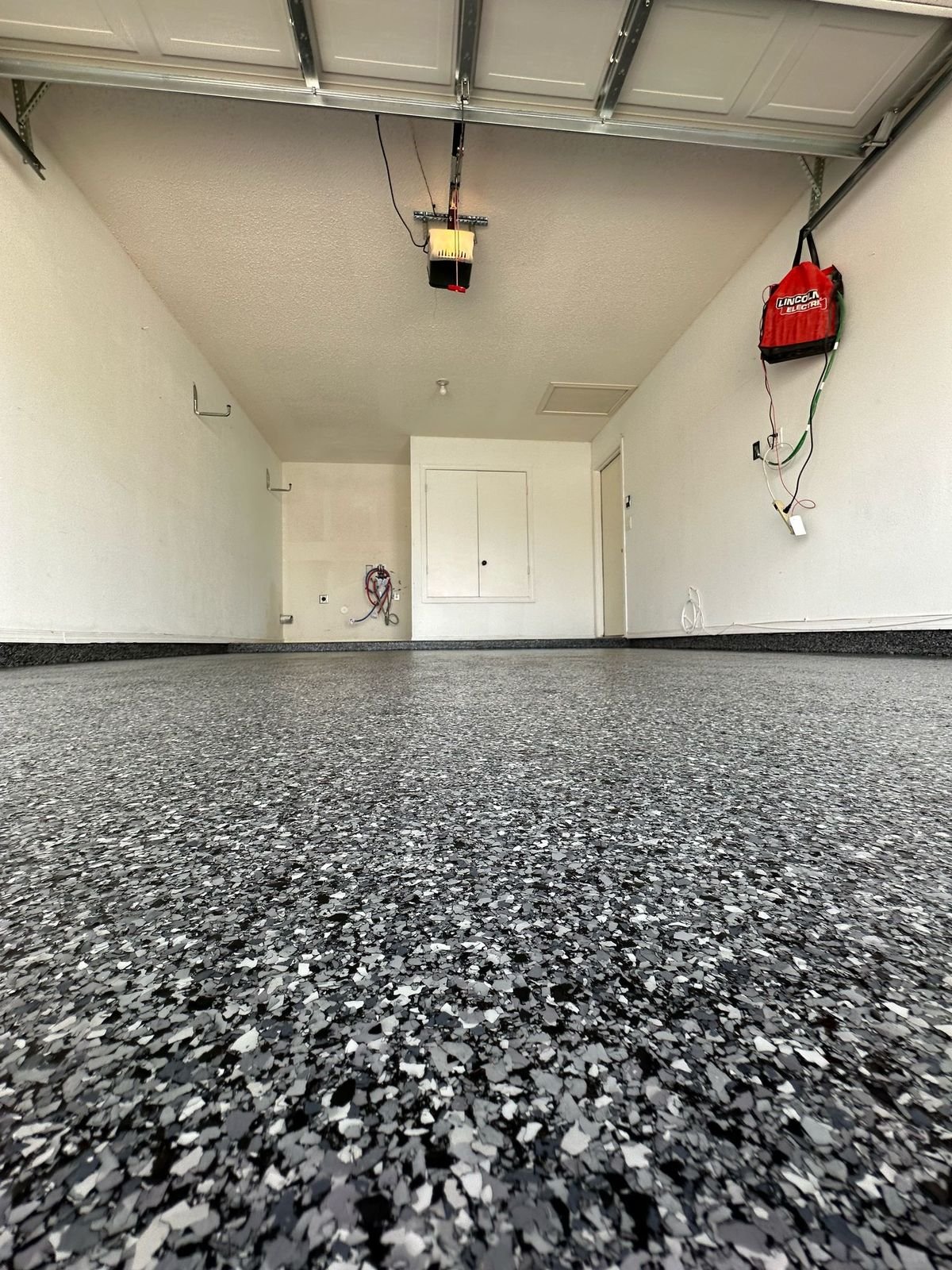 Gray and White Flake Epoxy Garage Floor installed by Epoxee in El Paso, TX