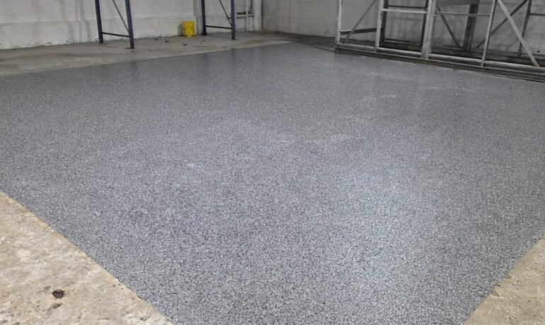 Light flake epoxy garage floor by Epoxee in El Paso, the kind of epoxy garage floor jack stands sit on