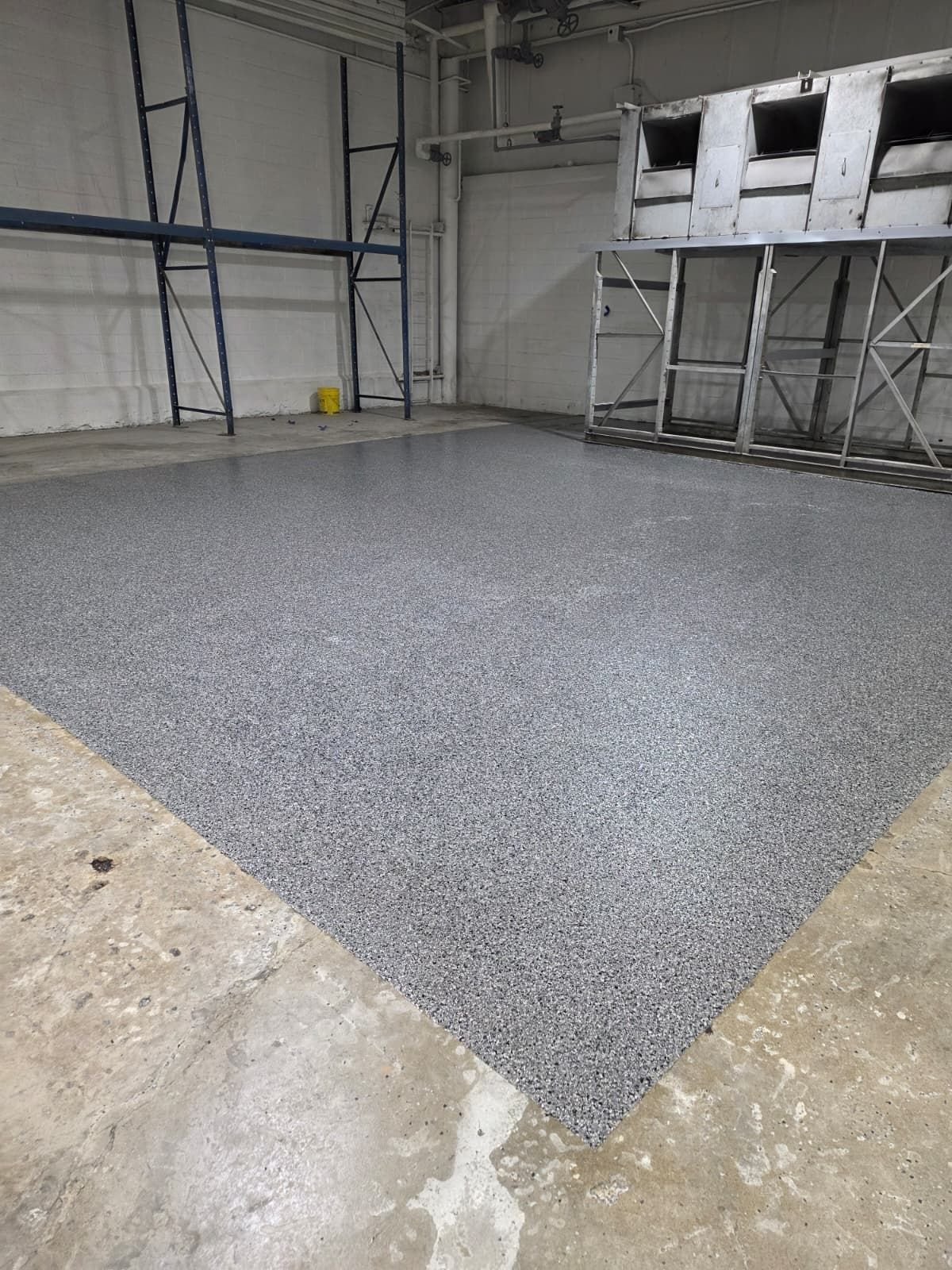 Light flake epoxy garage floor by Epoxee in El Paso, the kind of epoxy garage floor jack stands sit on
