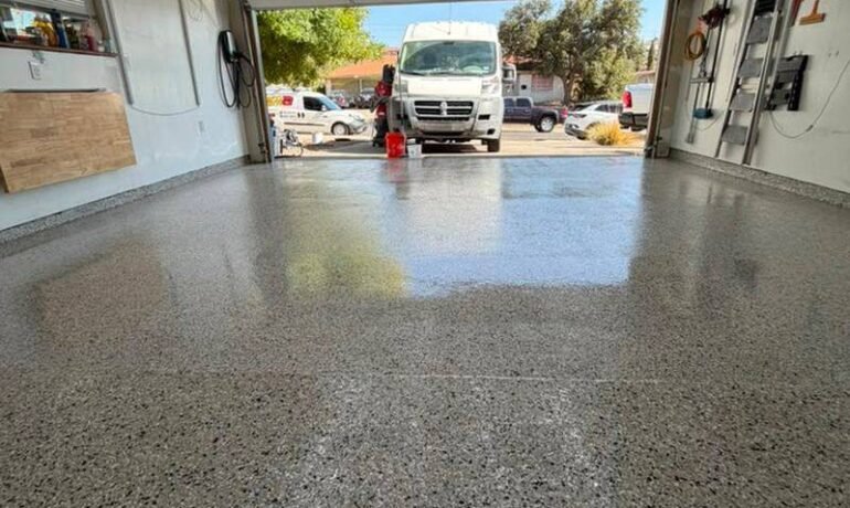 Garage floor with flake epoxy coating over filled control joints, El Paso installation