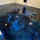 Blue-black metallic epoxy garage floor by Epoxee, installed after a concrete moisture test before epoxy