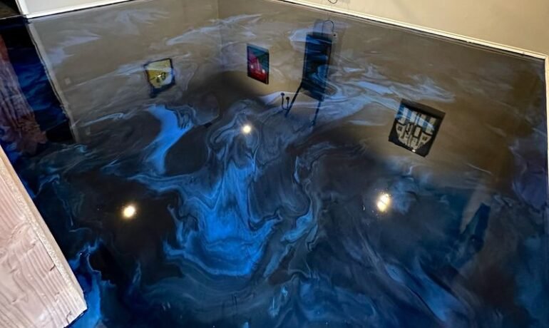 Blue-black metallic epoxy garage floor by Epoxee, installed after a concrete moisture test before epoxy